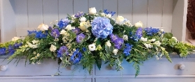 BLUE AND WHITE CASKET SPRAY